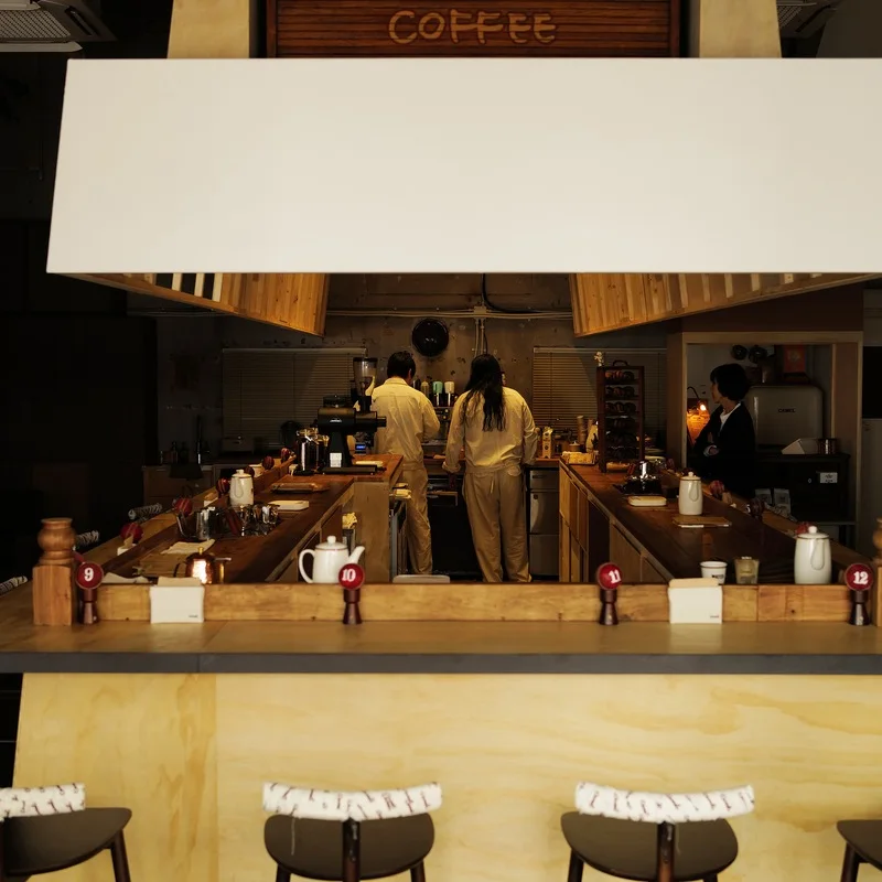 Warm wooden counter and overhead hood inside Camel Coffee Dosan 1