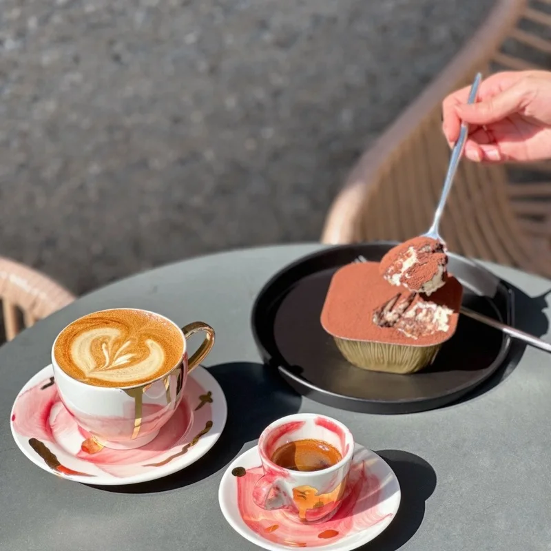 Latte, espresso and tiramisu on a table at Coffee Fiel Sinsa