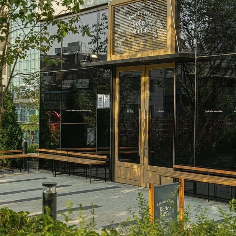 Entrance to Koffee Sniffer Centerfield beside its planted terrace